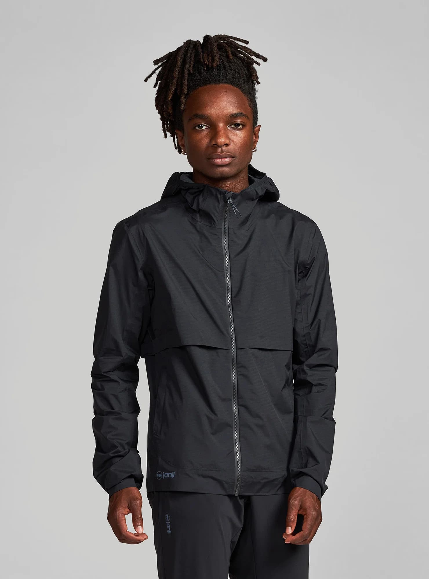 M's Rainrunner Pack Jacket by Janji — recommended by Jamie Hunyor
